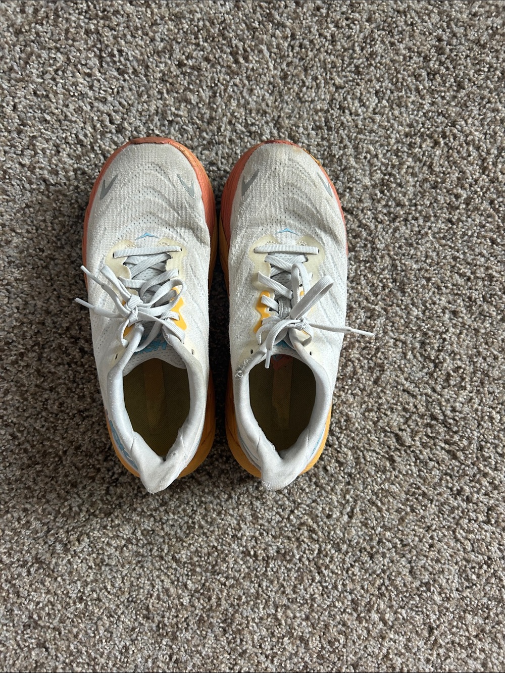 Hoka Neutral-White Running Shoes with Orange-to-Yellow Gradient Midsole